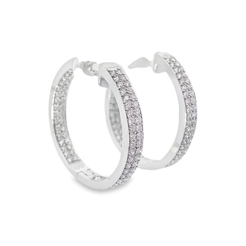 two white gold hoop earrings with small diamonds