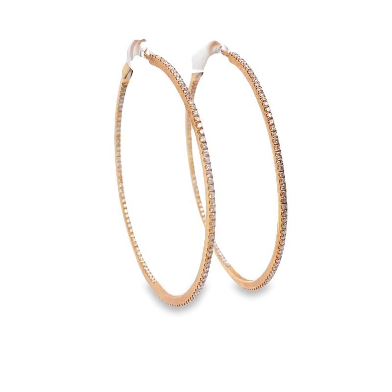 two large gold hoop earrings with diamonds