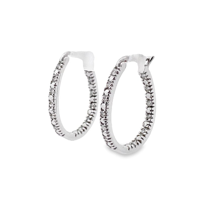 a pair of silver hoop earrings with white diamonds