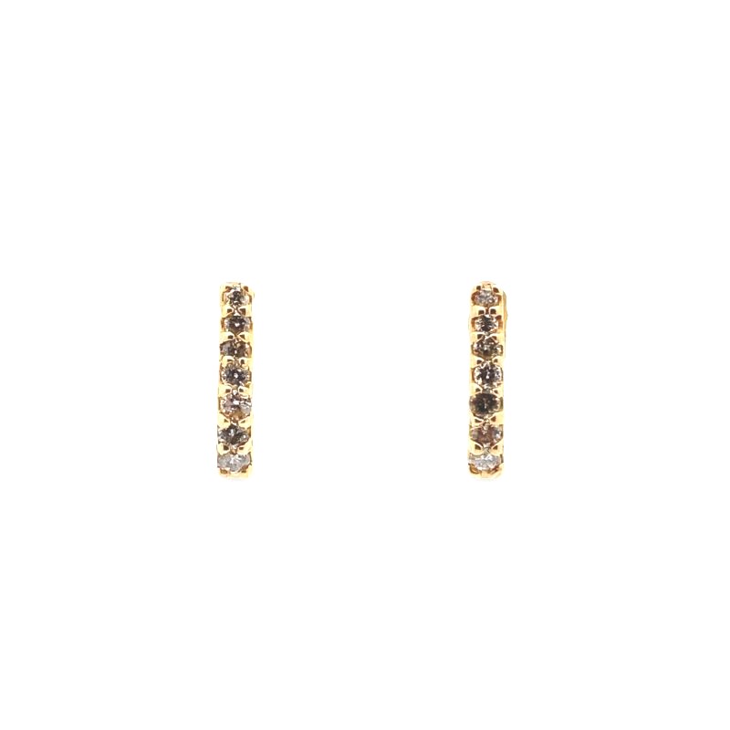 a pair of gold earrings with brown diamonds