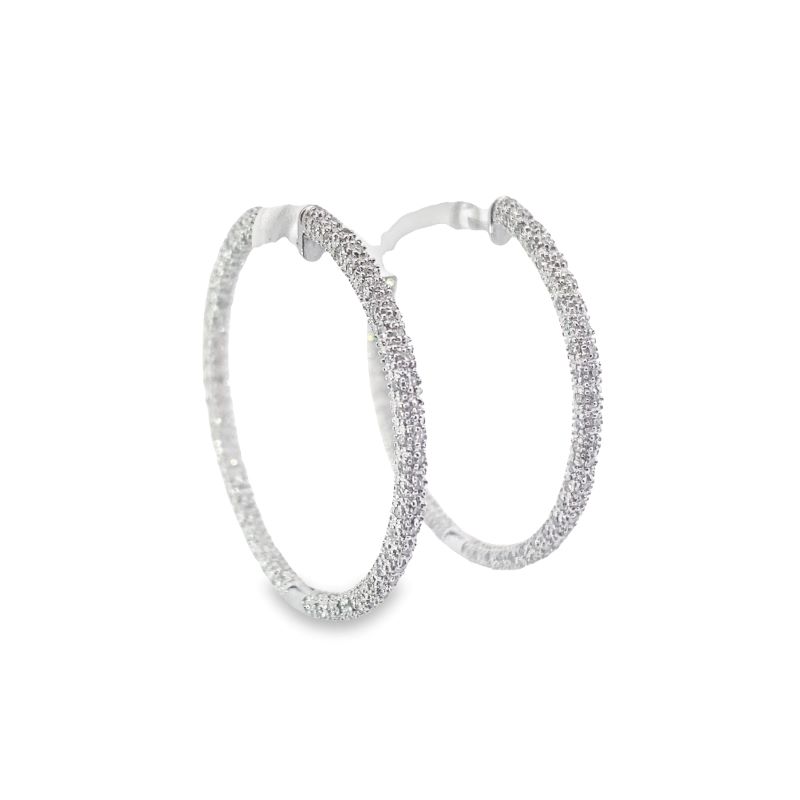 a pair of white gold hoop earrings with diamonds