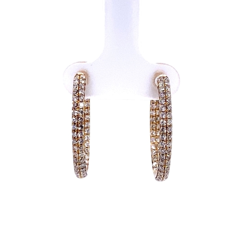 a pair of gold and diamond hoop earrings