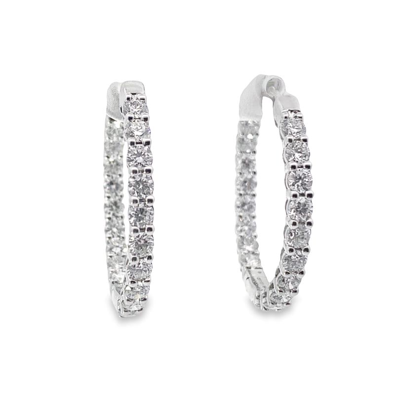 a pair of diamond hoop earrings