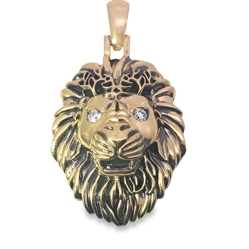 a gold lion head pendant with diamonds
