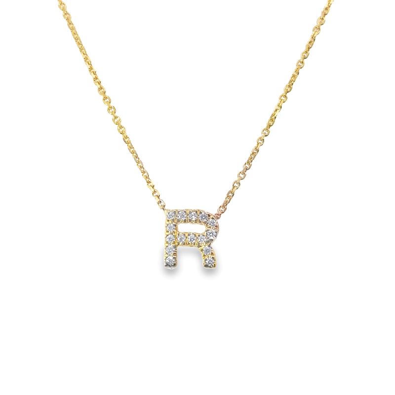 a diamond initial necklace with the letter p on it