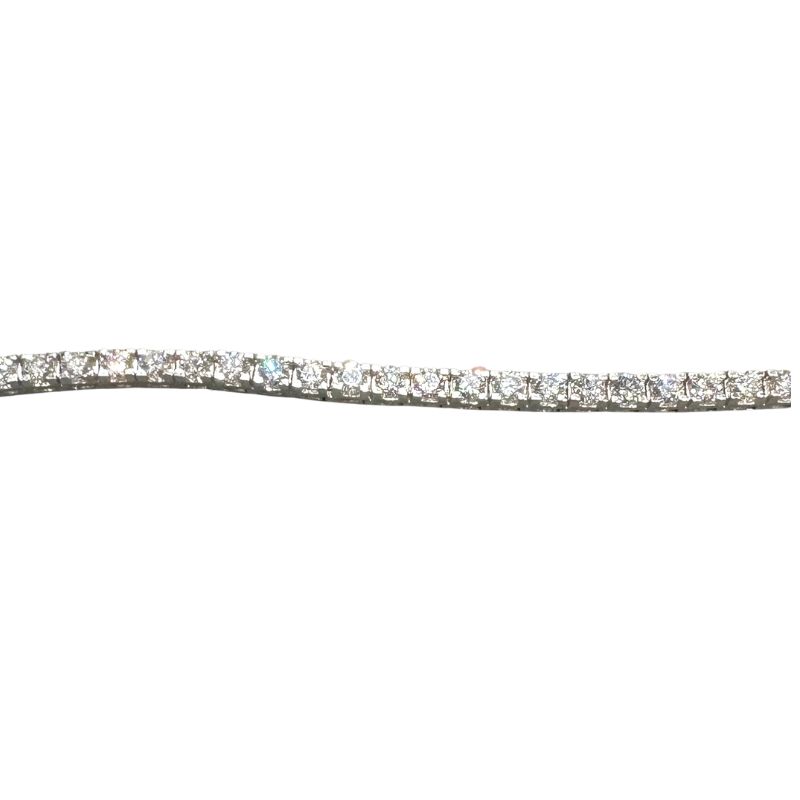 a white diamond bracelet on a white background