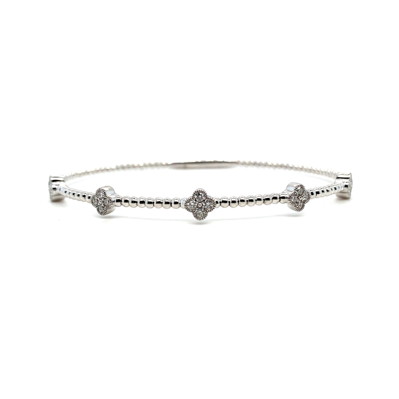 a silver bracelet with two hearts on it