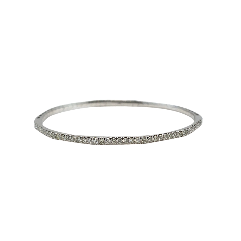 a thin silver ring with white diamonds