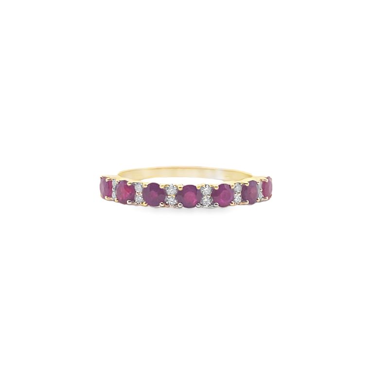 a yellow gold ring with ruby and white diamonds