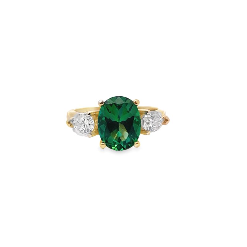 a green and white ring with three diamonds
