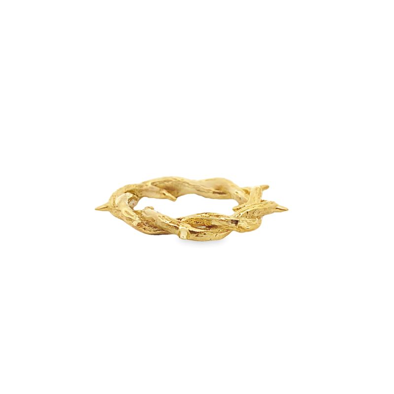 a gold ring with leaves on it