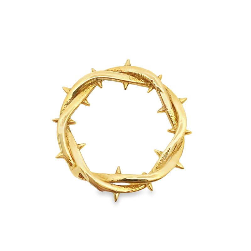 a gold ring with spikes on it