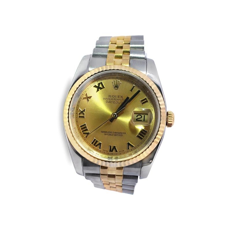 a rolex watch with two tone gold dial