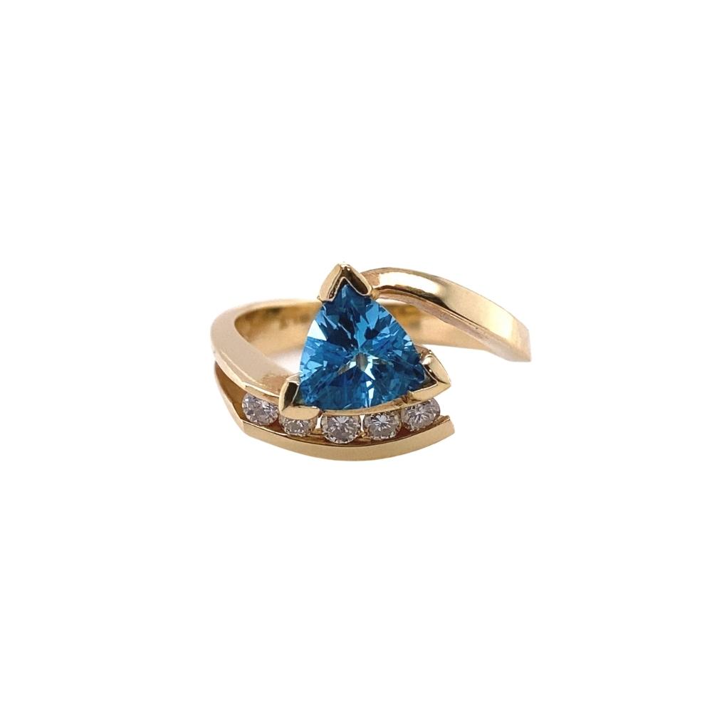 1.50ct Blue Topaz Trillion Ring with Diamond Channel Set, Free Form in 14kt yellow gold.