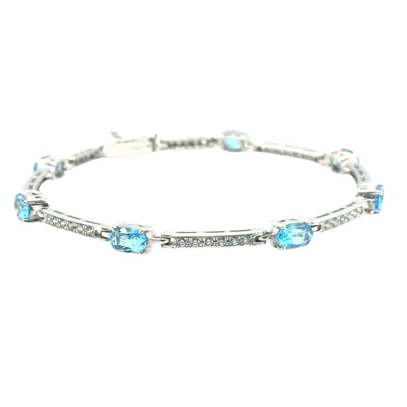 Oval Blue Topaz and CZ Station Bracelet in White Gold